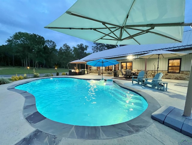 view of pool featuring a patio