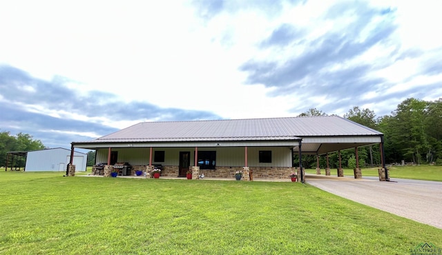 exterior space featuring a carport and a front yard