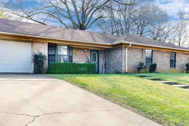 ranch-style home featuring a garage and a front yard