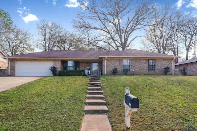 single story home featuring a garage and a front yard