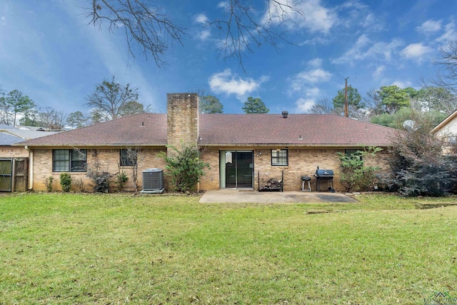 rear view of house featuring a patio area, a yard, and cooling unit