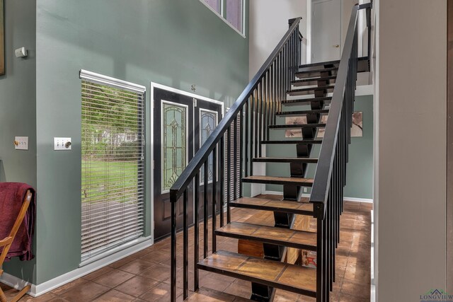 414 Harper Dr, Marshall, TX 75672 - stairs with a high ceiling and baseboards