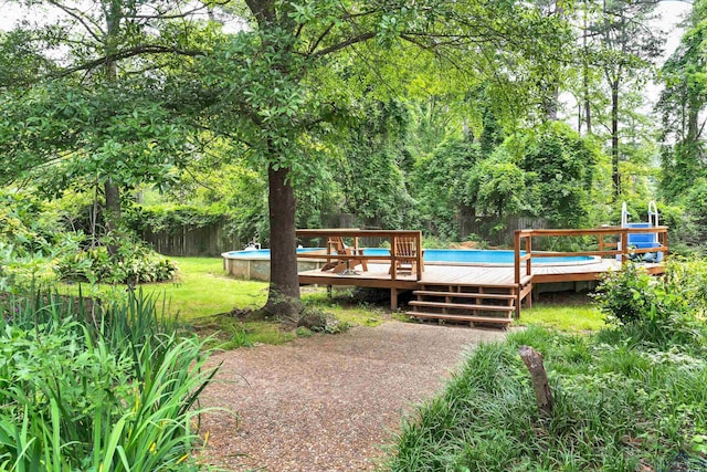 414 Harper Dr, Marshall, TX 75672 - exterior space with fence, an outdoor pool, and a deck