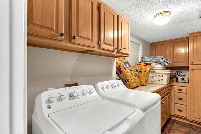 414 Harper Dr, Marshall, TX 75672 - laundry area with cabinet space, washer and clothes dryer, and a textured ceiling