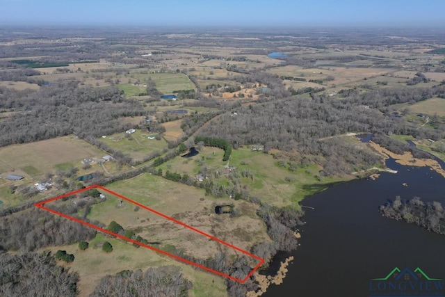 aerial view with a rural view and a water view