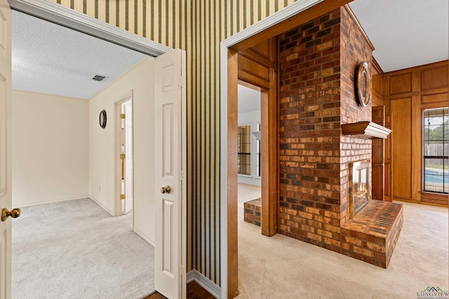 1307 Spring Tree Ln, Kilgore, TX 75662 - hall with light carpet and a textured ceiling