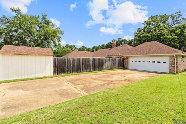 1307 Spring Tree Ln, Kilgore, TX 75662 - view of yard with concrete driveway and a garage