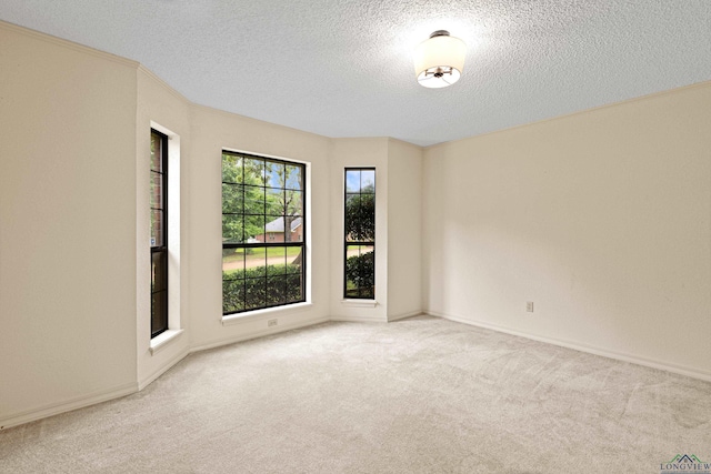 1307 Spring Tree Ln, Kilgore, TX 75662 - unfurnished room featuring a textured ceiling, carpet flooring, and baseboards