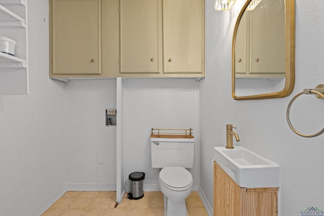 1307 Spring Tree Ln, Kilgore, TX 75662 - bathroom with toilet, tile patterned flooring, vanity, and baseboards