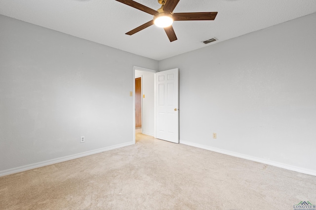 1307 Spring Tree Ln, Kilgore, TX 75662 - unfurnished room with ceiling fan, light colored carpet, and baseboards