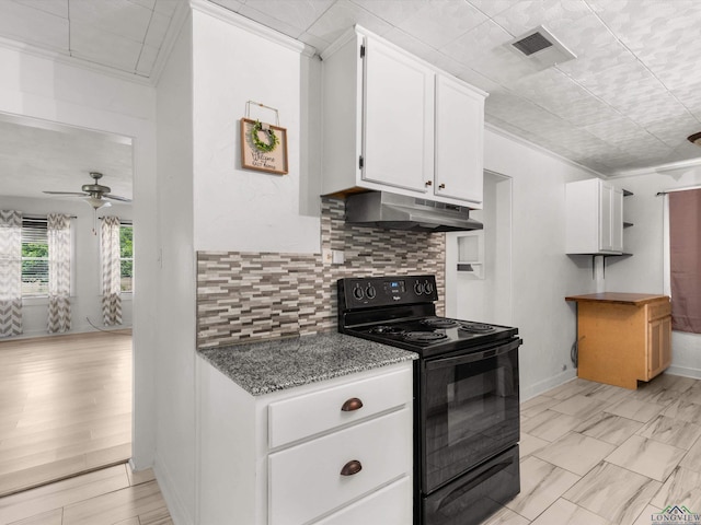 3506 Dudley Rd, Kilgore, TX 75662 - kitchen featuring black range with electric cooktop, under cabinet range hood, white cabinetry, tasteful backsplash, and ceiling fan