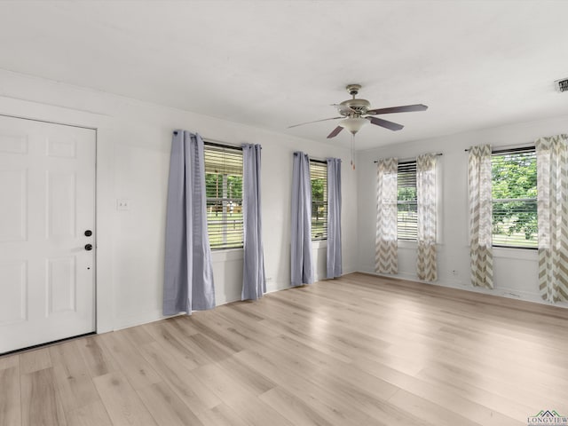 3506 Dudley Rd, Kilgore, TX 75662 - spare room featuring light wood-style floors and a ceiling fan