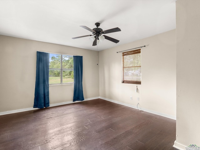 3506 Dudley Rd, Kilgore, TX 75662 - spare room with a ceiling fan, dark wood-style floors, and baseboards