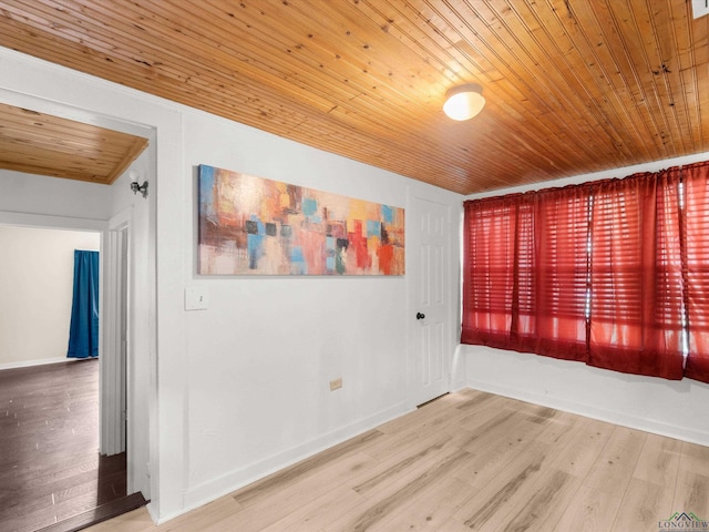 3506 Dudley Rd, Kilgore, TX 75662 - empty room featuring wood ceiling, wood finished floors, and baseboards
