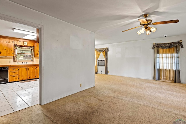 carpeted spare room with ceiling fan and cooling unit