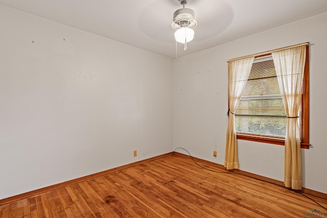 unfurnished room with hardwood / wood-style flooring and ceiling fan