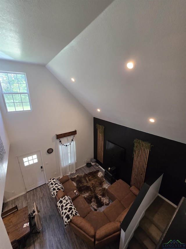 203 W Gay Ave, Gladewater, TX 75647 - living room with wood finished floors, lofted ceiling, recessed lighting, and baseboards