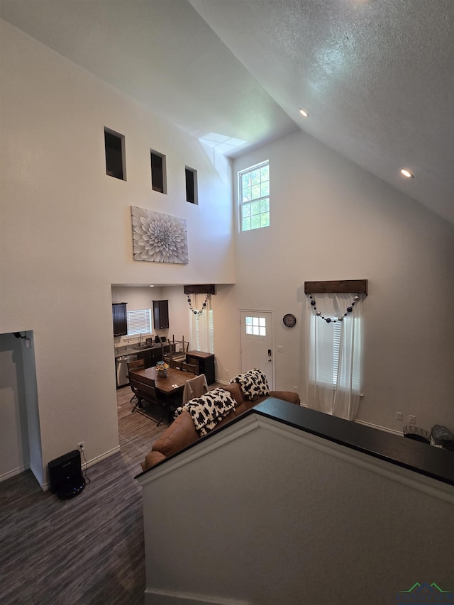 203 W Gay Ave, Gladewater, TX 75647 - living area featuring high vaulted ceiling, wood finished floors, baseboards, and pool table