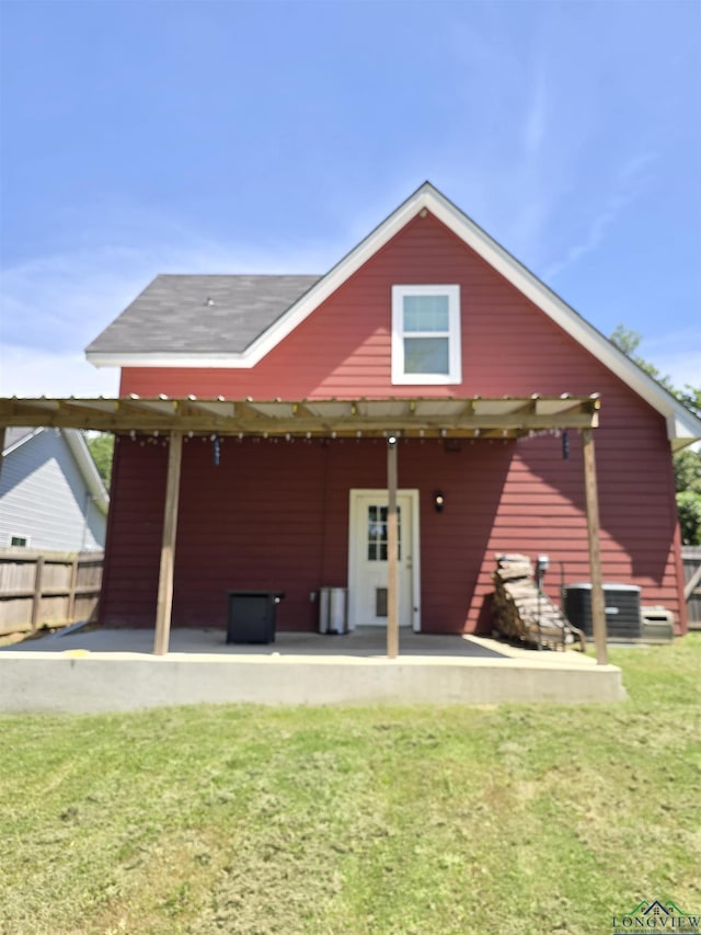 203 W Gay Ave, Gladewater, TX 75647 - rear view of house with a patio area and cooling unit