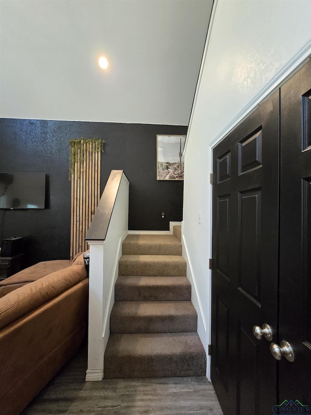 203 W Gay Ave, Gladewater, TX 75647 - stairs with wood finished floors and baseboards