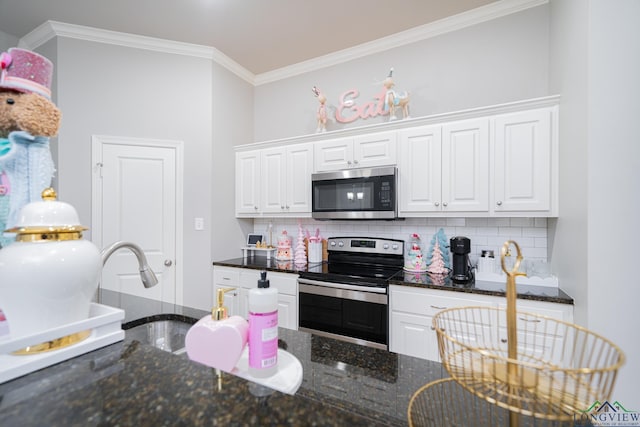 kitchen featuring white cabinets, decorative backsplash, dark stone countertops, and stainless steel appliances