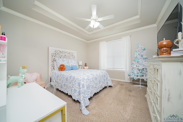 carpeted bedroom featuring ceiling fan, a raised ceiling, and ornamental molding