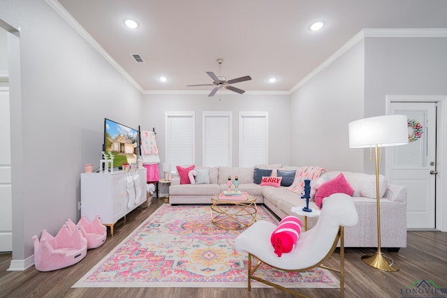 living room featuring ceiling fan, dark hardwood / wood-style floors, and crown molding