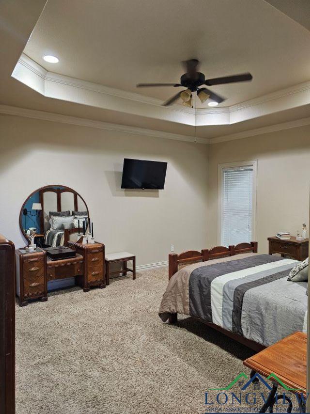 240 Cedar Ridge Rd, Longview, TX 75602 - carpeted bedroom featuring a tray ceiling, ornamental molding, baseboards, a ceiling fan, and recessed lighting