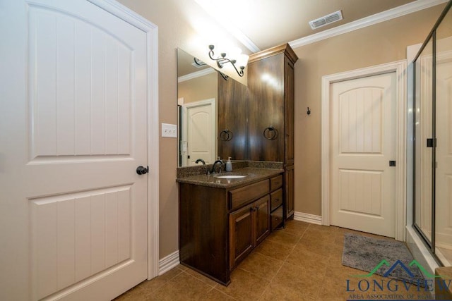240 Cedar Ridge Rd, Longview, TX 75602 - bathroom with crown molding, baseboards, vanity, tile patterned flooring, and a shower with shower door