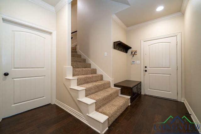 240 Cedar Ridge Rd, Longview, TX 75602 - foyer entrance with crown molding, dark wood finished floors, stairway, and baseboards