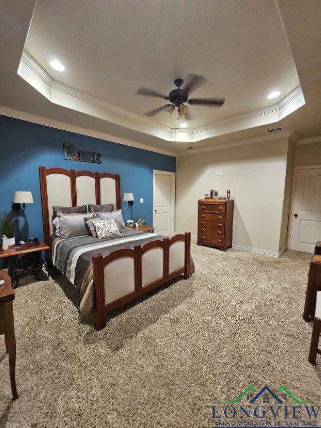 240 Cedar Ridge Rd, Longview, TX 75602 - bedroom featuring a raised ceiling, crown molding, carpet floors, baseboards, and recessed lighting