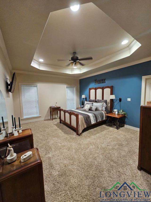 240 Cedar Ridge Rd, Longview, TX 75602 - bedroom featuring a tray ceiling, crown molding, carpet floors, baseboards, and recessed lighting