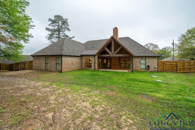 240 Cedar Ridge Rd, Longview, TX 75602 - back of house featuring a chimney, brick siding, roof with shingles, a patio, and a gate