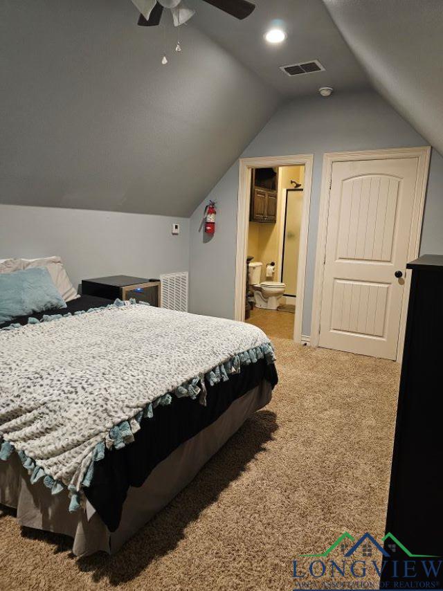 240 Cedar Ridge Rd, Longview, TX 75602 - bedroom with carpet, lofted ceiling, ceiling fan, and ensuite bathroom