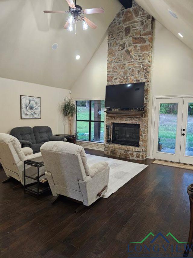 240 Cedar Ridge Rd, Longview, TX 75602 - living room with high vaulted ceiling, ceiling fan, wood-type flooring, a fireplace, and french doors