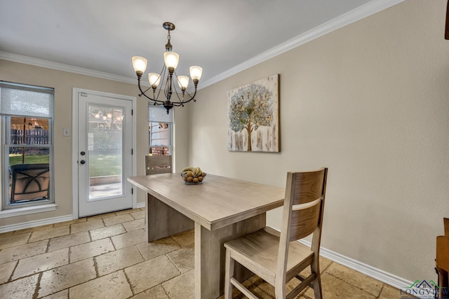 dining area featuring a chandelier and ornamental molding