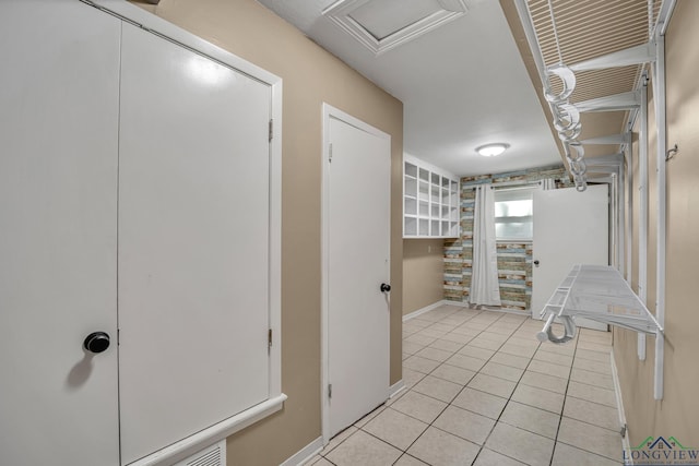 interior space featuring light tile patterned flooring