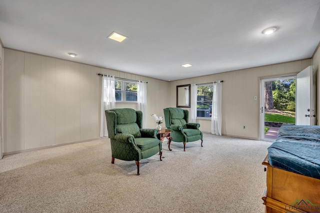 bedroom with access to outside and light colored carpet