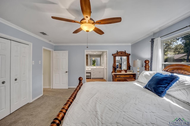 bedroom with ceiling fan, light colored carpet, ornamental molding, and a closet