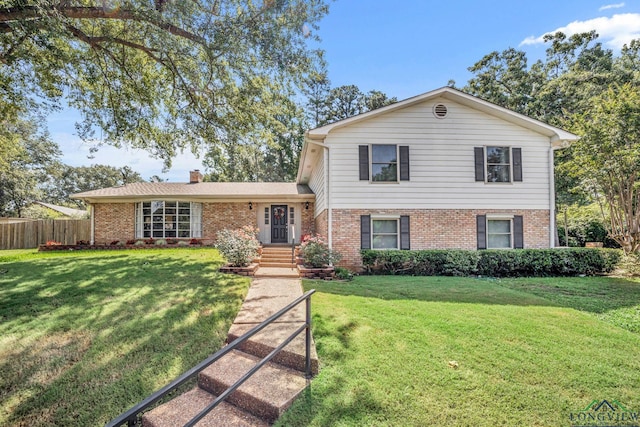 tri-level home featuring a front lawn