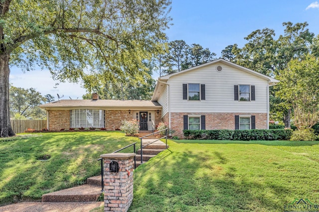 split level home featuring a front lawn