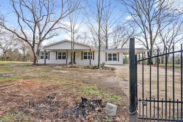 view of front of house with a porch and a carport