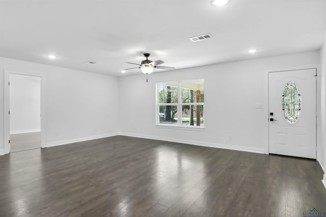 foyer with ceiling fan and dark hardwood / wood-style flooring