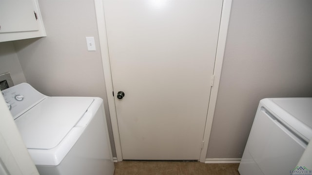 washroom with cabinets and independent washer and dryer