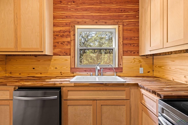 kitchen with light brown cabinets, range, and sink