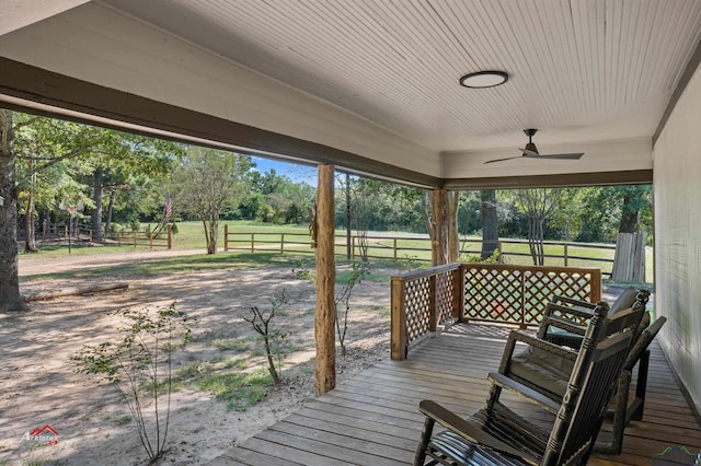 wooden deck featuring ceiling fan