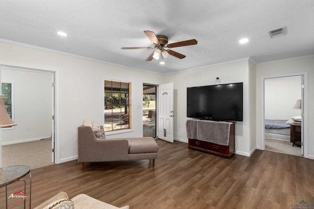 living room featuring dark hardwood / wood-style flooring, a textured ceiling, and ceiling fan