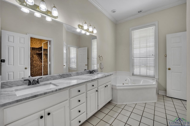 bathroom featuring tile patterned floors, a tub, crown molding, and vanity