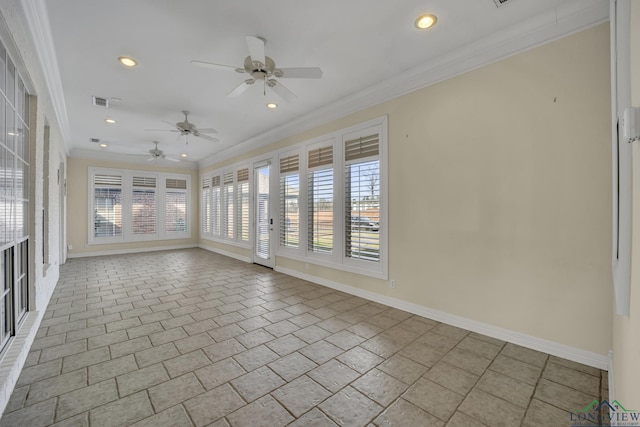 unfurnished sunroom featuring ceiling fan