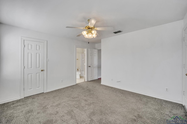 carpeted empty room featuring ceiling fan